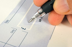 Signing a cheque.